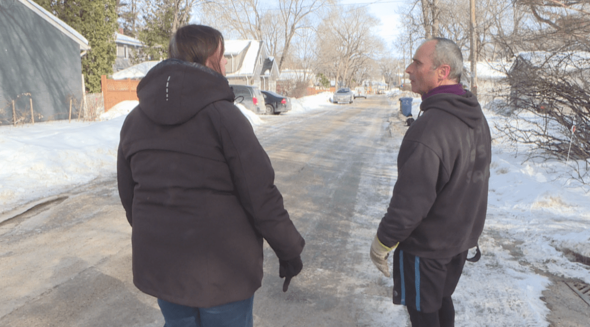 Cindy Yusishin and Bill Kastner discuss the recent water main breaks on their street.