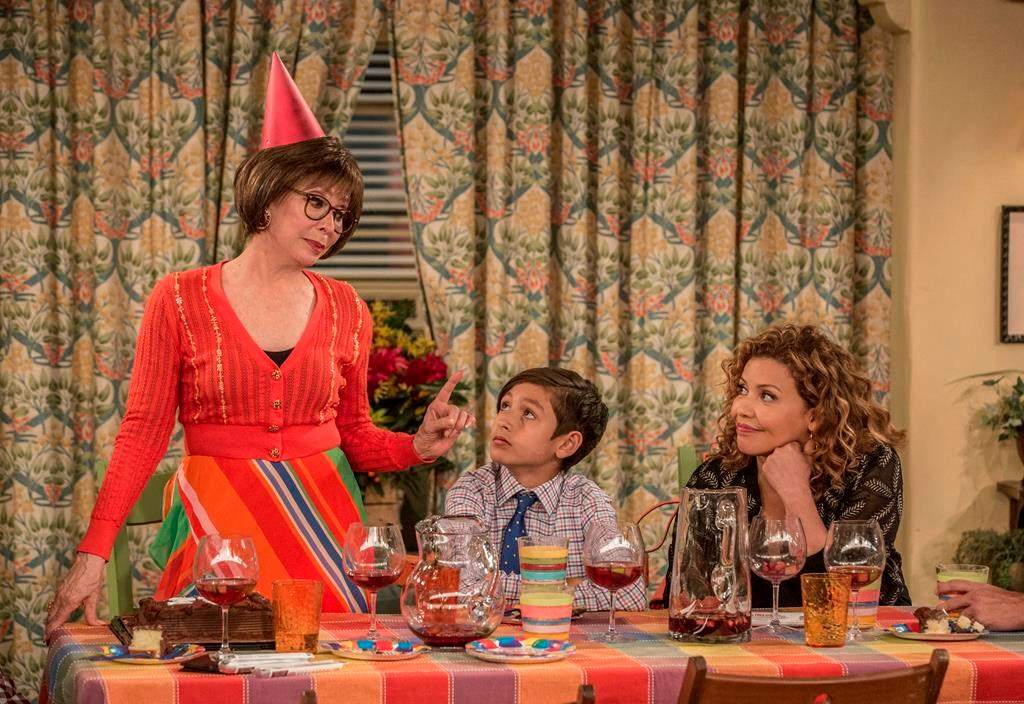 Rita Moreno, from left, Marcel Ruiz and Justina Machado in a scene from 'One Day At A Time.'.