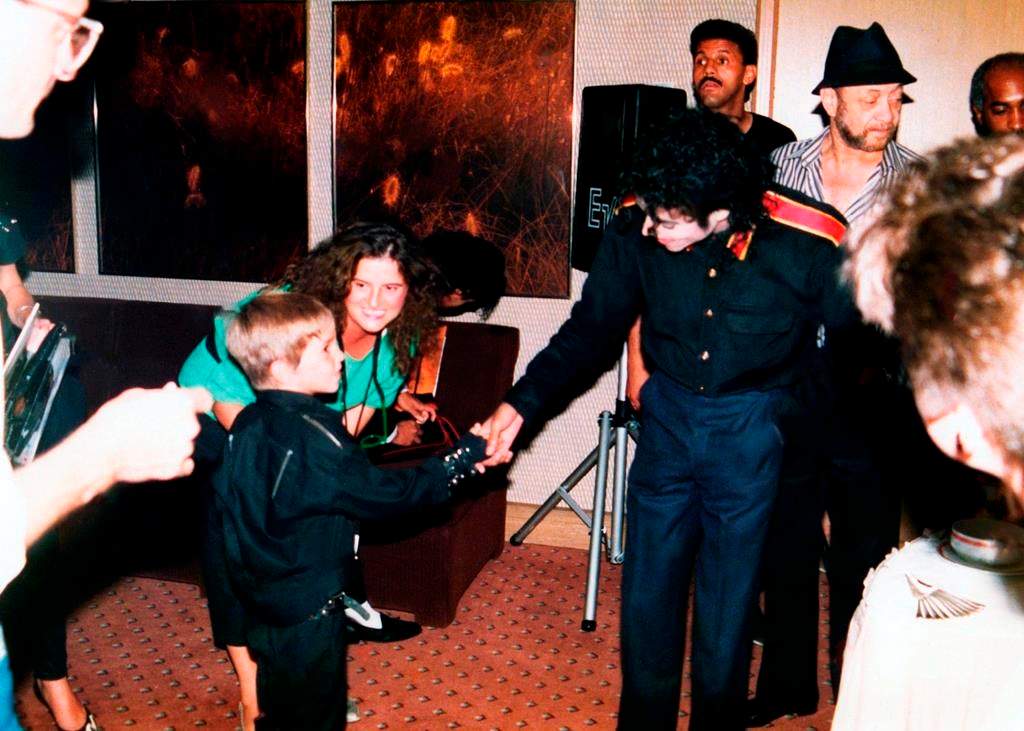 A young Wade Robson shaking hands with pop icon Michael Jackson in 1987 in a scene from HBO’s documentary, ‘Leaving Neverland.’