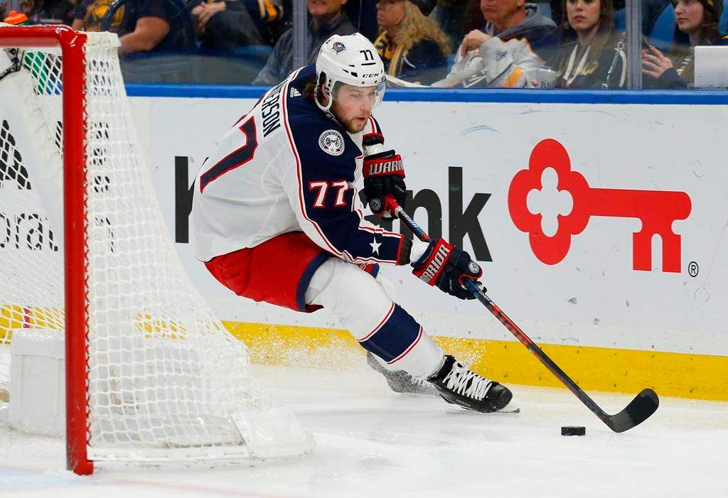 In this file photo, Josh Anderson (77), formerly of the Columbus Blue Jackets carries the puck behind the net during the second period of an NHL hockey game in 2019. Anderson has signed a seven-year deal with the Montreal Canadiens. Thursday, Oct. 8, 2020.