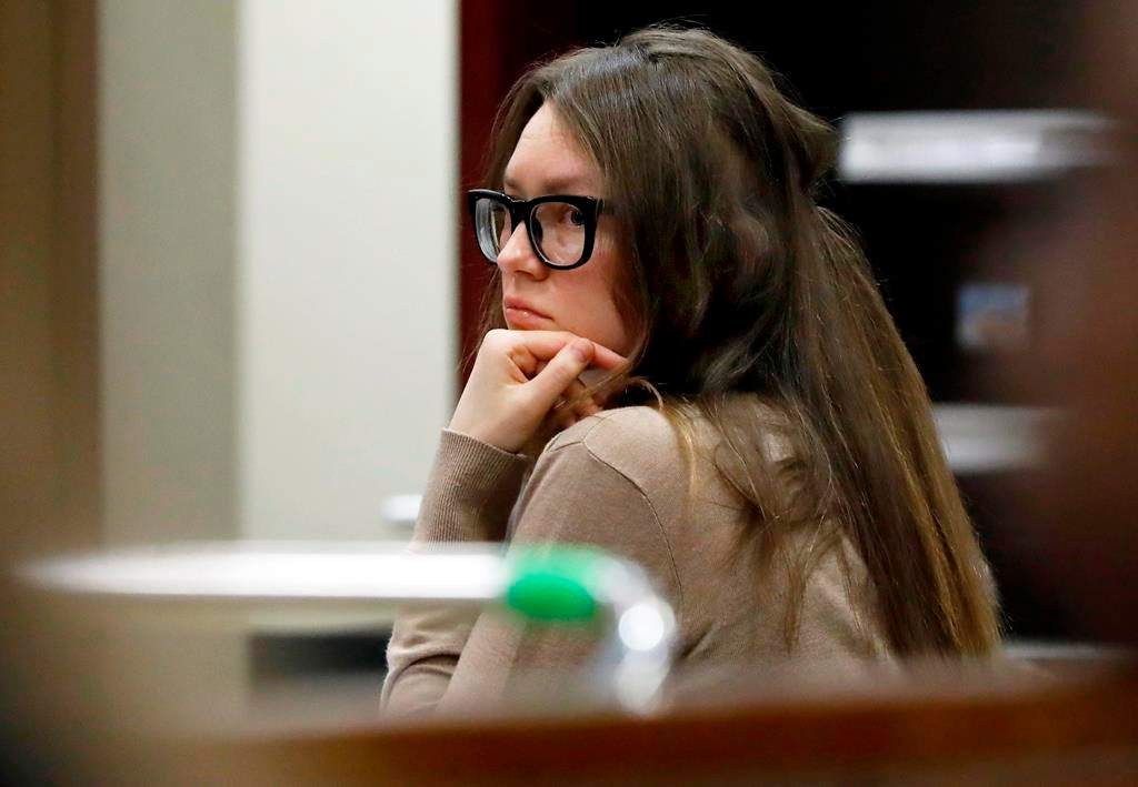 Anna Sorokin listens as her defense attorney Todd Spodek delivers his opening statement in her trial in New York State Supreme Court, Wednesday, March 27, 2019, in New York,