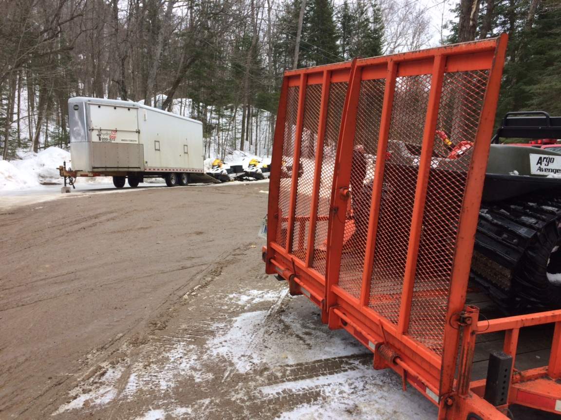 Emergency responders used snowmobiles and ATVS to reach an injured hydro worker.
