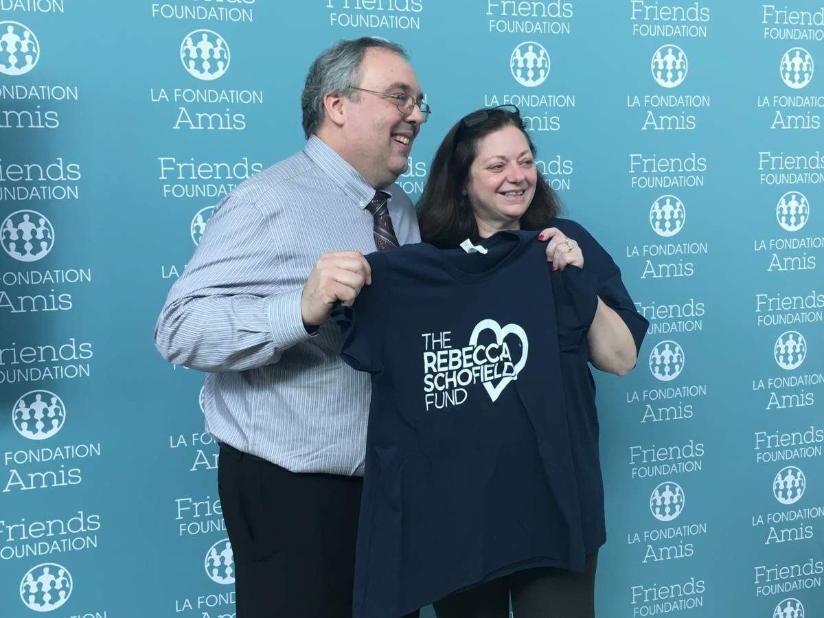 Becca Schofield's parents, Darren and Anne, pose for a photo during Thursday's announcement. 