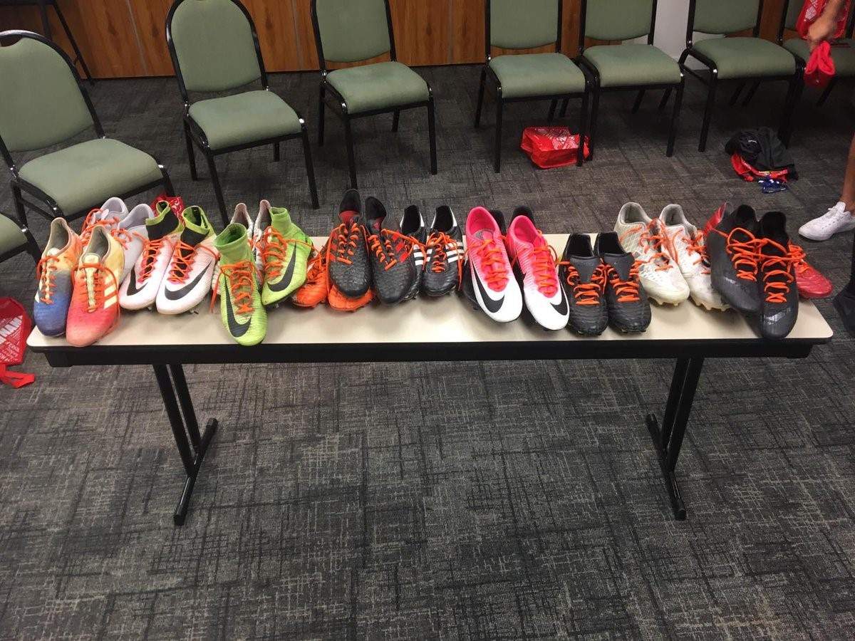 Team Canada\’s shoes with orange laces.