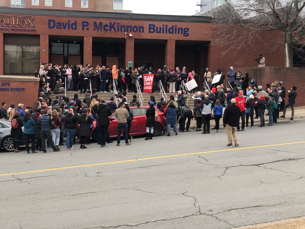 Protesters calling for the end to street checks gather outside Halifax Regional Police headquarters on Saturday, March 30, 2019.