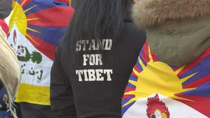 Calgarians made their way from city hall to the Chinese consulate on Sunday to rally behind Chinese-occupied Tibet.