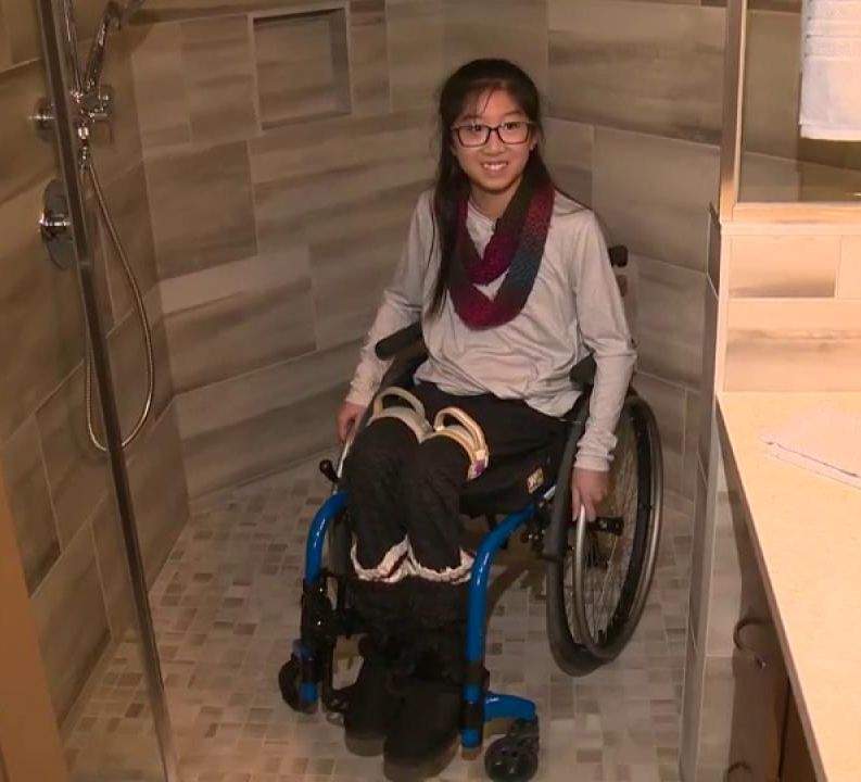Hailey Cheng, 12, shows off the new accessible shower inside her home in Sherwood Park, Alta. Where builder Alair Homes carried out a big renovation to make the house wheelchair-friendly. Monday, March 4, 2019.