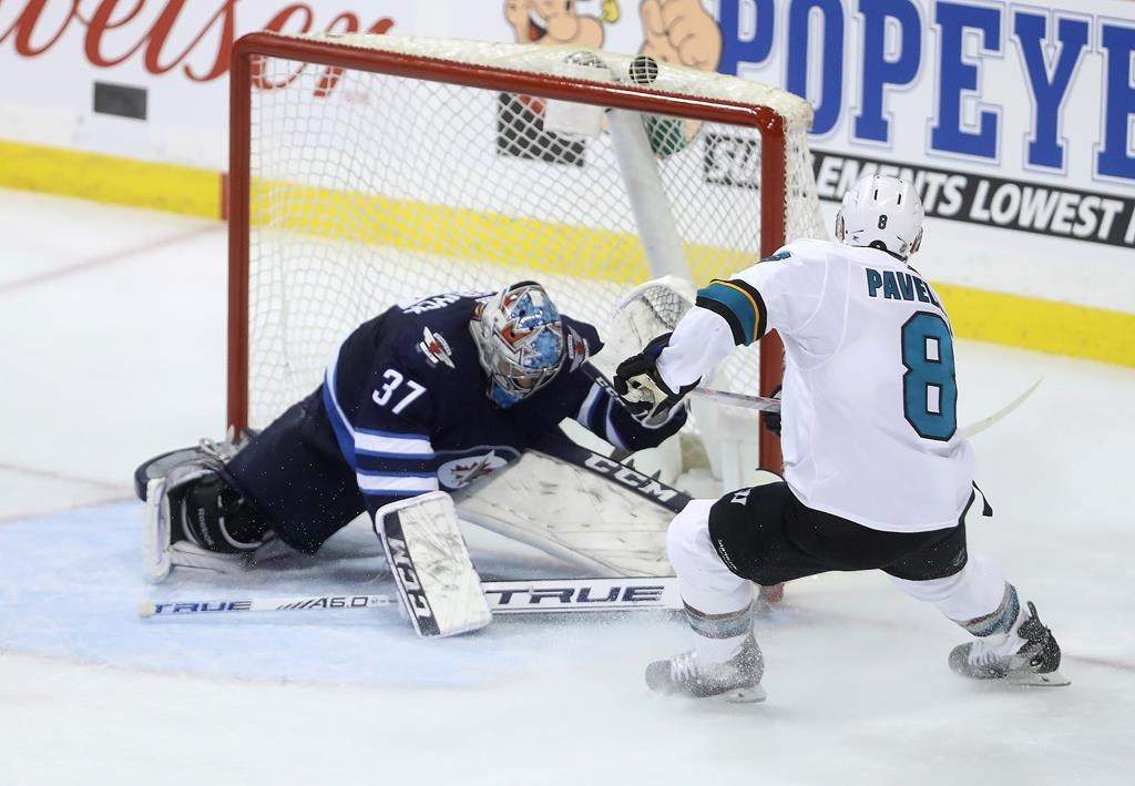 San Jose Sharks' Joe Pavelski (8) scores into the top of the net with a few seconds left to win the game against the Winnipeg Jets during third period NHL hockey action in Winnipeg, Tuesday, March 12, 2019. THE CANADIAN PRESS/Trevor Hagan.