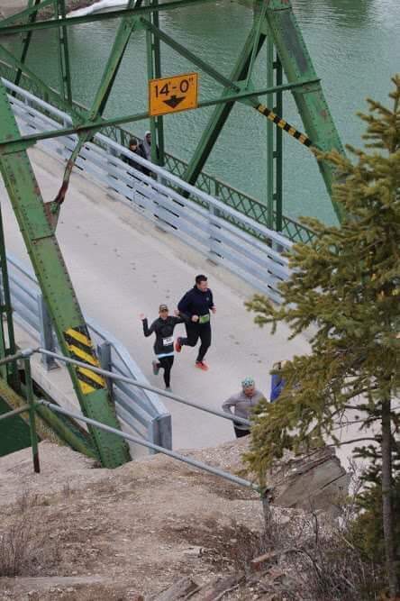 Phil Alain and his friend/coach Janelle run a 10-kilometre race in Jasper on April 13, 2019.