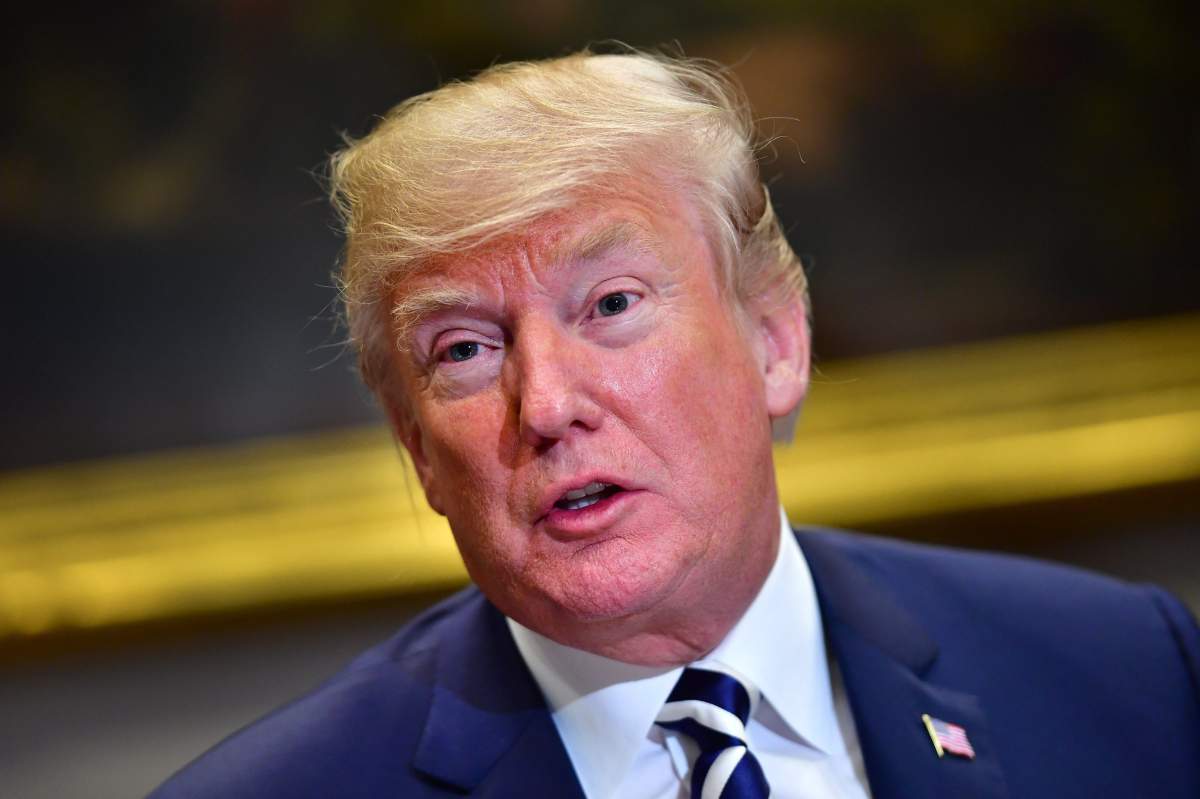 FILE - President Donald J. Trump holds a law enforcement roundtable on sanctuary cities, in the Roosevelt Room at the White House in Washington, DC, USA, 20 March 2018. 