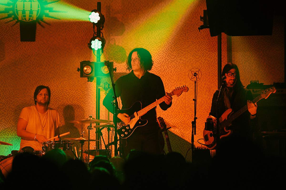 (L-R) Patrick Keeler, Jack White and Jack Lawrence of The Raconteurs, performing onstage at the Third Man Records Blue Room in Nashville, Tenn. on April 8, 2019.