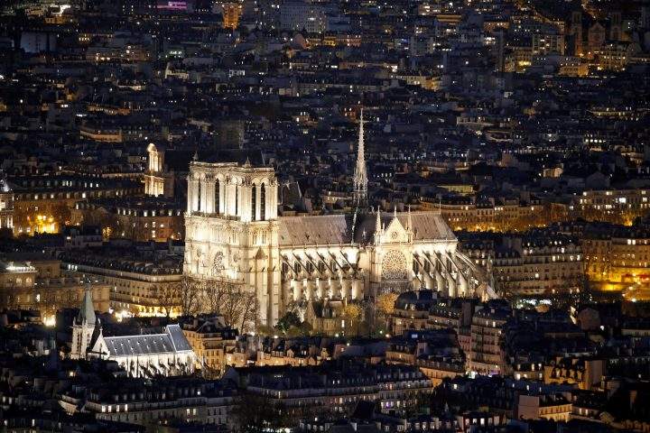 A general view shows the Notre Dame Cathedral and rooftops at night in Paris, France, Nov. 28, 2016.