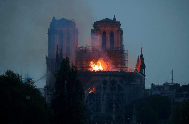 Firefighters douse flames of the burning Notre Dame Cathedral in Paris, April 15, 2019.