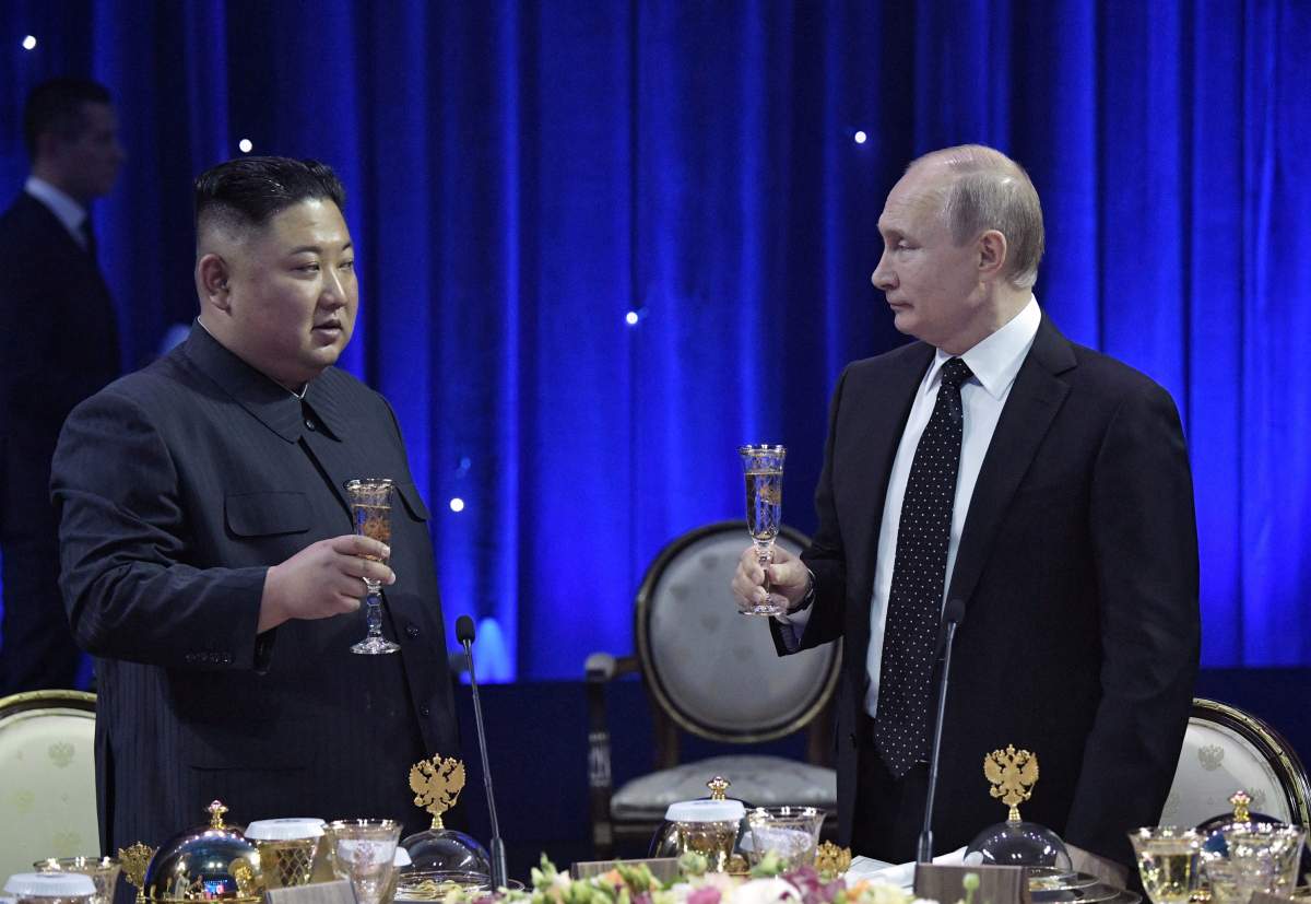 Russia’s President Vladimir Putin (R) and North Korea’s leader Kim Jong Un attend an official reception following their talks in Vladivostok, Russia April 25, 2019. \