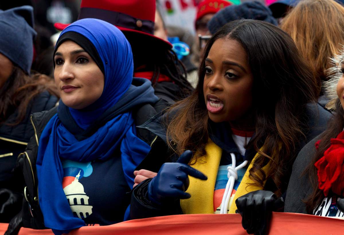 Co-presidents of the 2019 Women’s March Linda Sarsour, left, and Tamika Mallory, centre, march along with others demonstrators on Pennsylvania Avenue during the Women’s March in Washington on Saturday, Jan. 19, 2019. (AP Photo/Jose Luis Magana)