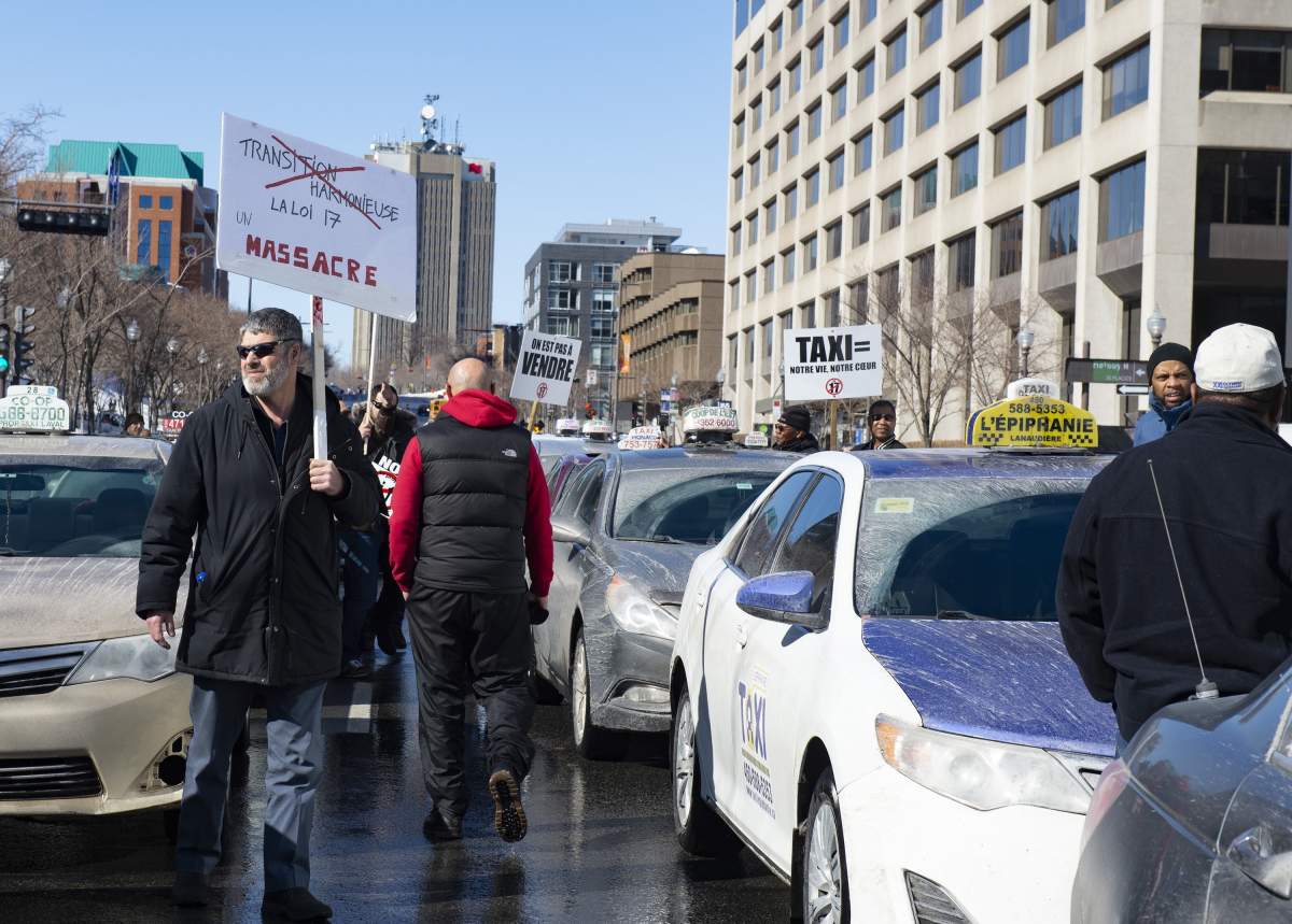 Taxi drivers demonstrate against Bill 17, legislation modifying the taxi industry, Wednesday, April 10, 2019 near the legislature in Quebec City. 
