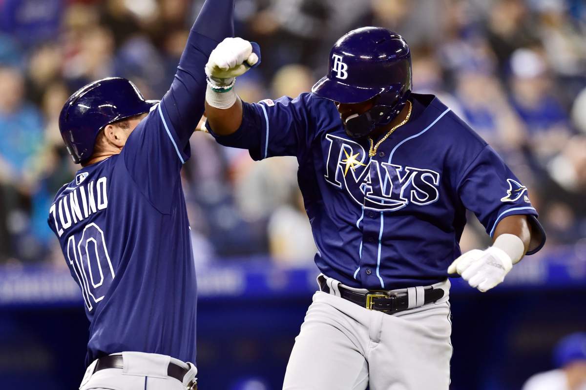 Tampa Bay Rays’ Guillermo Heredia, right, celebrates his solo home run with Mike Zunino (10) during eighth inning MLB baseball action against the Toronto Blue Jays in Toronto on Sunday, April 14, 2019. THE CANADIAN PRESS/Frank Gunn