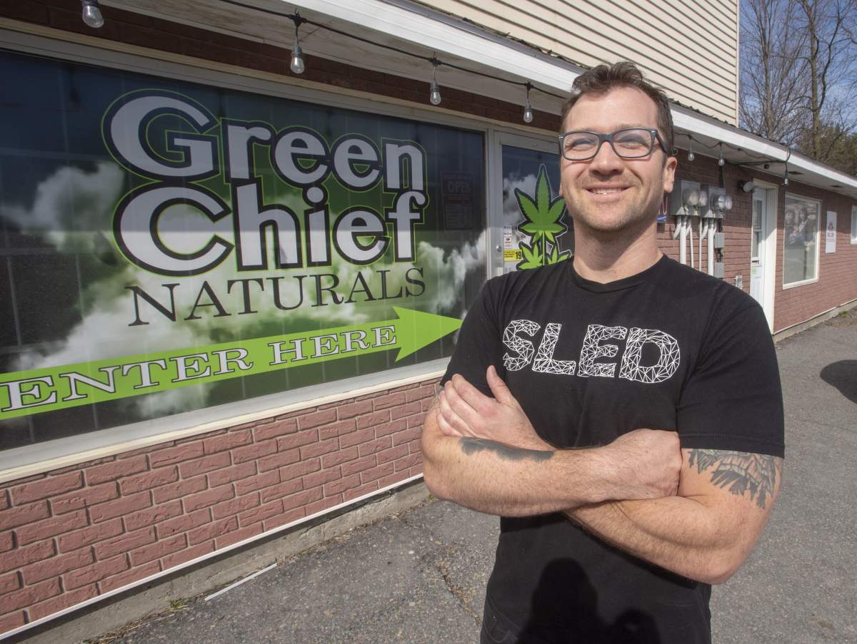 Owner Heath Day is seen in front of his CBD store, the non-intoxicating component of cannabis, Thursday, April 11, 2019 in the Mohawk territory of Akwesasne, Ont.