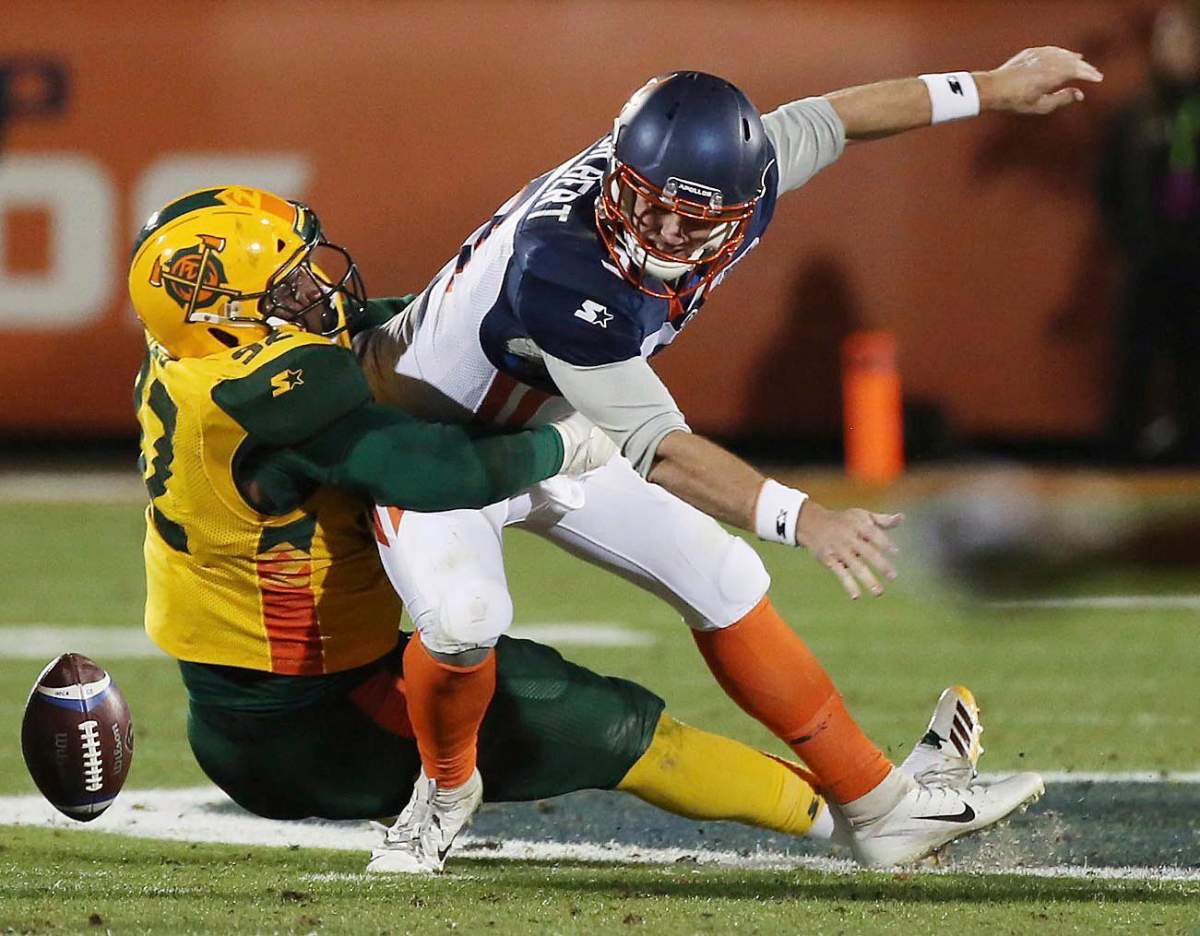 Arizona Hotshots defensive end Rykeem Yates (92) knocks the ball away from Orlando Apollos quarterback Garrett Gilbert (3) during an Alliance of American Football game in Orlando, Fla., Saturday, March 16, 2019.