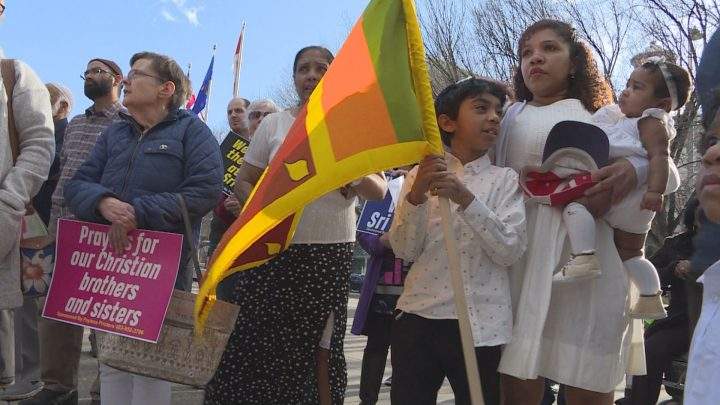 Calgarians gather at city hall on Tuesday, standing in solidarity to honour the hundreds of victims of the Sri Lankan bombings.