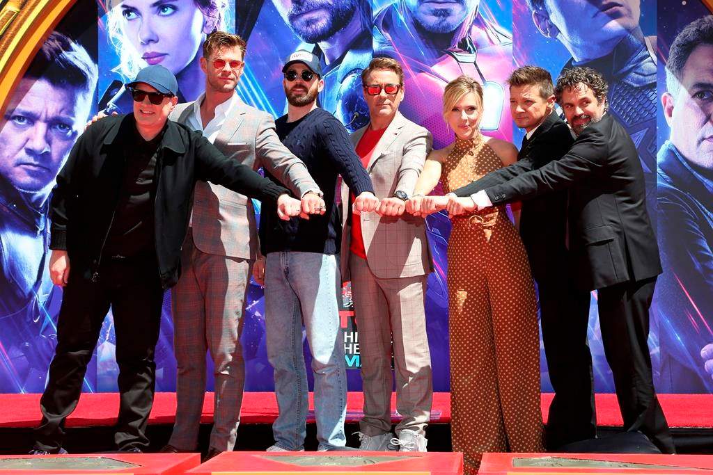 Marvel Studios President Kevin Feige, from left, poses with members of the cast of “Avengers: End Game,” Chris Hemsworth, Chris Evans, Robert Downey Jr., Scarlett Johansson, Jeremy Renner and Mark Ruffalo at a hand and footprint ceremony at the TCL Chinese Theatre on Tuesday, April 23, 2019, in Los Angeles. (Photo by Willy Sanjuan/Invision/AP)