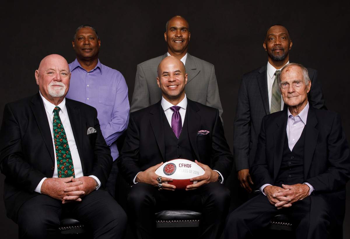 The 2019 class of the Canadian Football Hall of Fame, including (L to R, back row) Mervyn Fernandez, David Williams, Terry Greer, (L to R, front row) Jim Hopson, Jon Cornish and Frank Smith. Not pictured: Ernie Pitts.