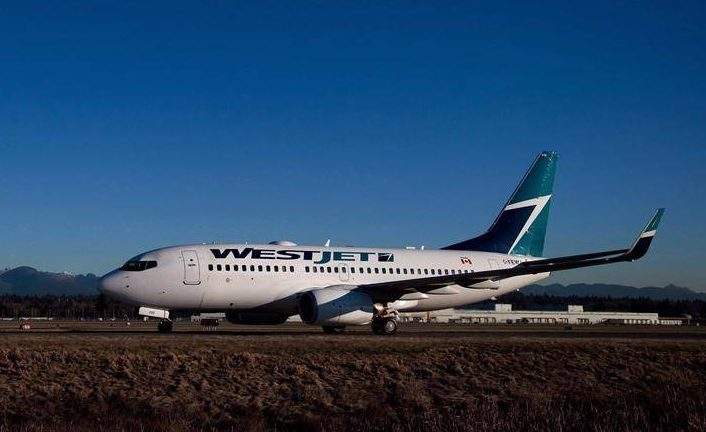 A Westjet Boeing 737-700 taxis to a gate after arriving at Vancouver International Airport in Richmond, B.C., on February 3, 2014.