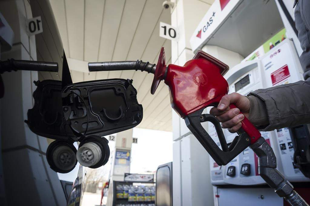 A woman fills up her with gas in Toronto, on Monday April 1, 2019. Canada's budget watchdog says revenues from the federal carbon price will be more than $2.6 billion this year and exceed $6 billion within five years. THE CANADIAN PRESS/Christopher Katsarov.