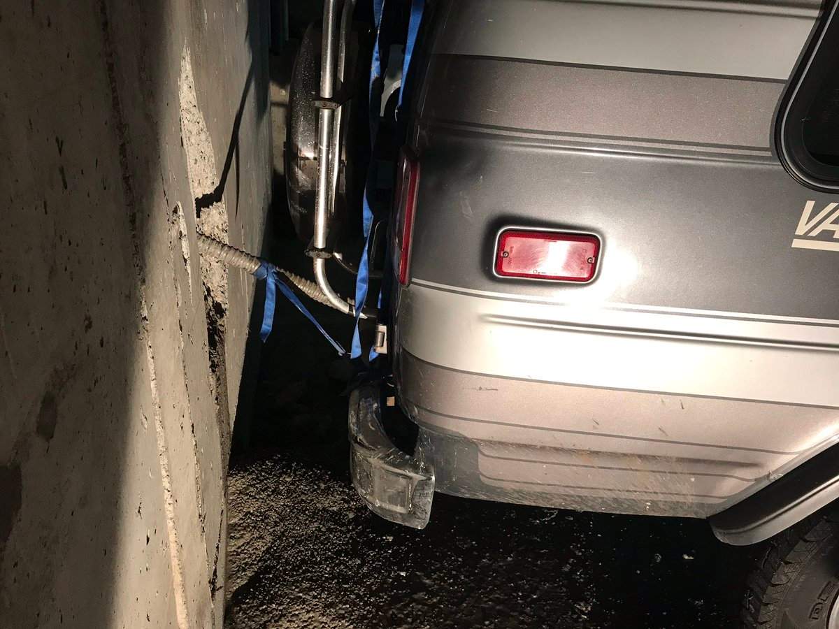 Firefighters say an "errant drill" pierced a wall and a vehicle's fuel tank on Thursday morning. 