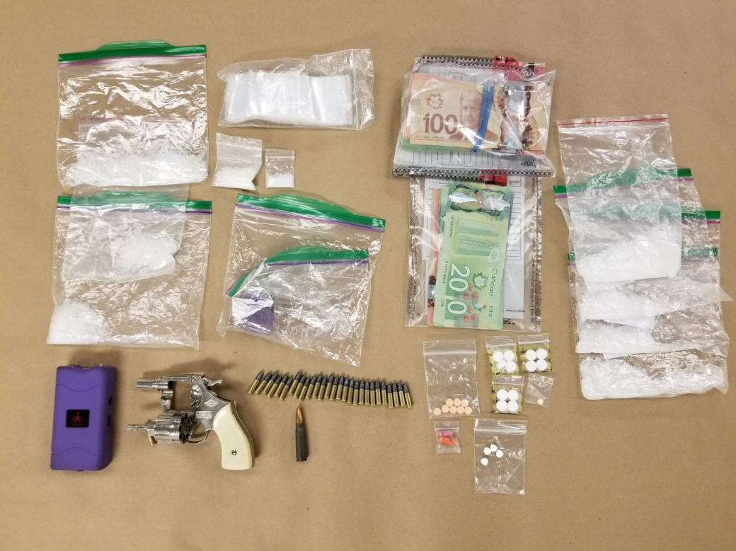 London police have charged two twin brothers, 33, in connection with a weapons and drugs bust. 