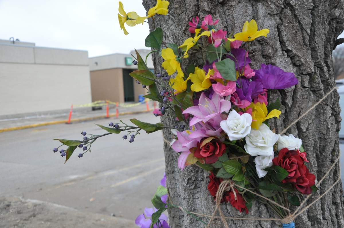 Flowers attached to a tree near where Tamara Orellana Azolas died.