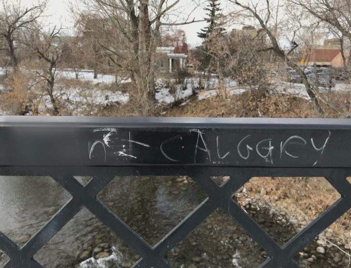 An obscene message, blurred by Global News, along a pathway in Calgary’s Mission neighbourhood.