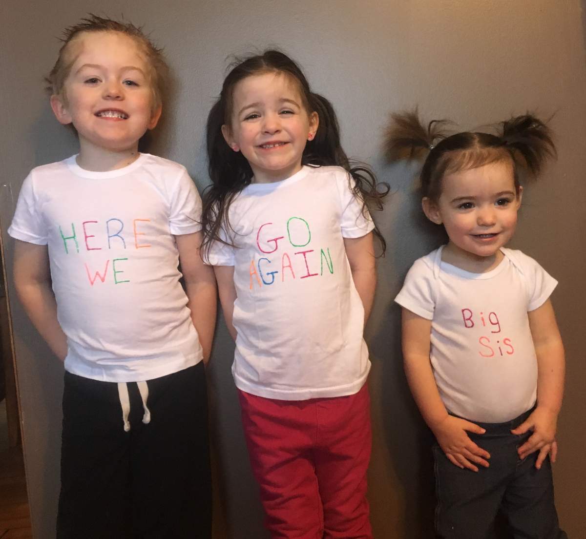 Blake Stewart, 4, Paisley Stewart, 4, and Peyton, 4, pose for a photo.