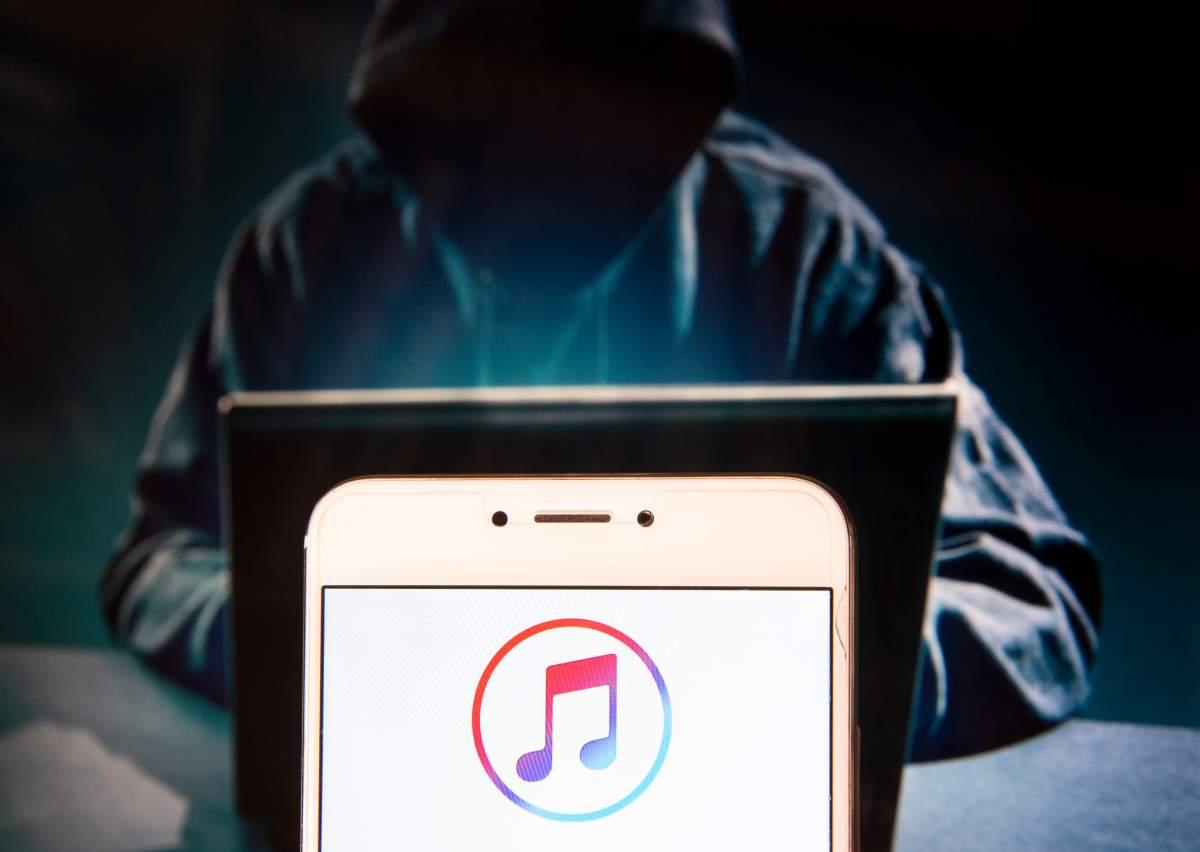iTunes logo is seen on an Android mobile device.