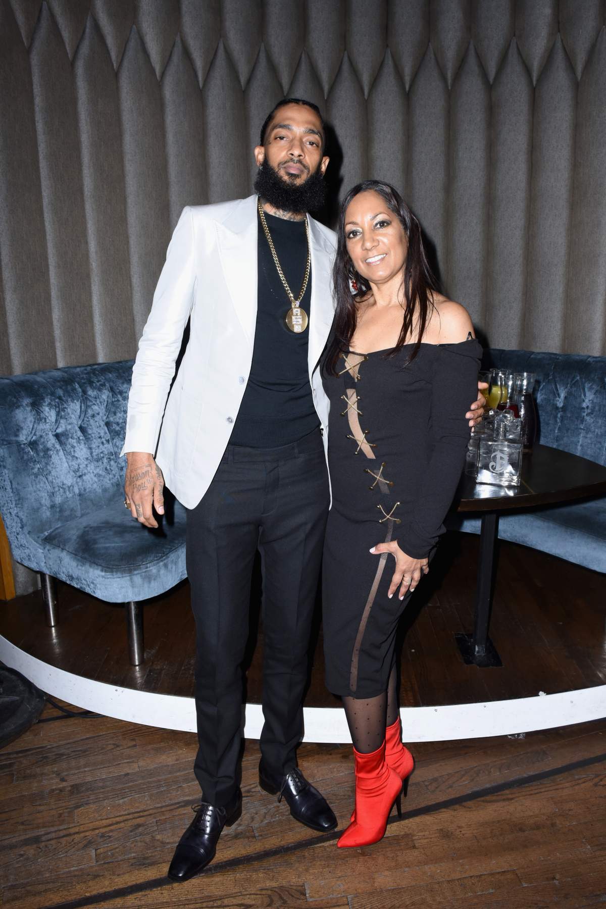 Nipsey Hussle (L) and his mother attend the PUMA x Nipsey Hussle 2019 Grammy Nomination Party at The Peppermint Club on Jan. 16, 2019, in Los Angeles, California. (Photo by Vivien Killilea/Getty Images for PUMA)