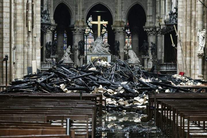 The altar surrounded by charred debris inside the Notre Dame Cathedral in Paris in the aftermath of a fire that devastated the cathedral.