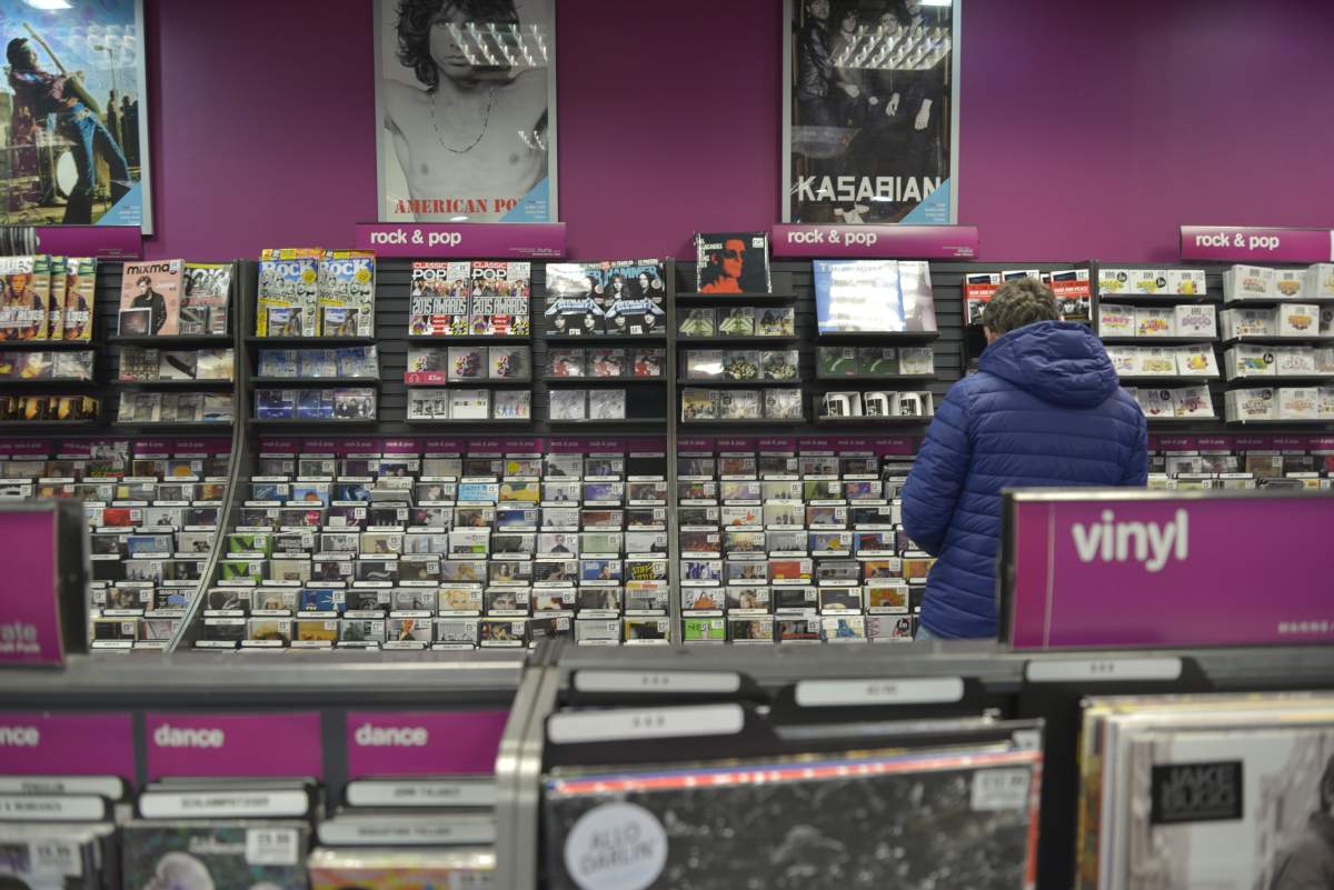 People browsing in a branch of the high-street retail chain HMV in Stockport on March 25, 2015.