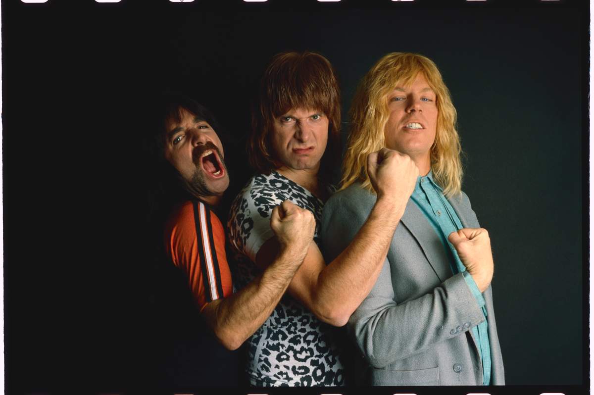 Satirical metal band Spinal Tap: Derek Smalls, Nigel Tufnel (centre), David Saint Hubbins, Tufnel's custom amp came with a volume control that 'goes to 11' instead of the usual 10.