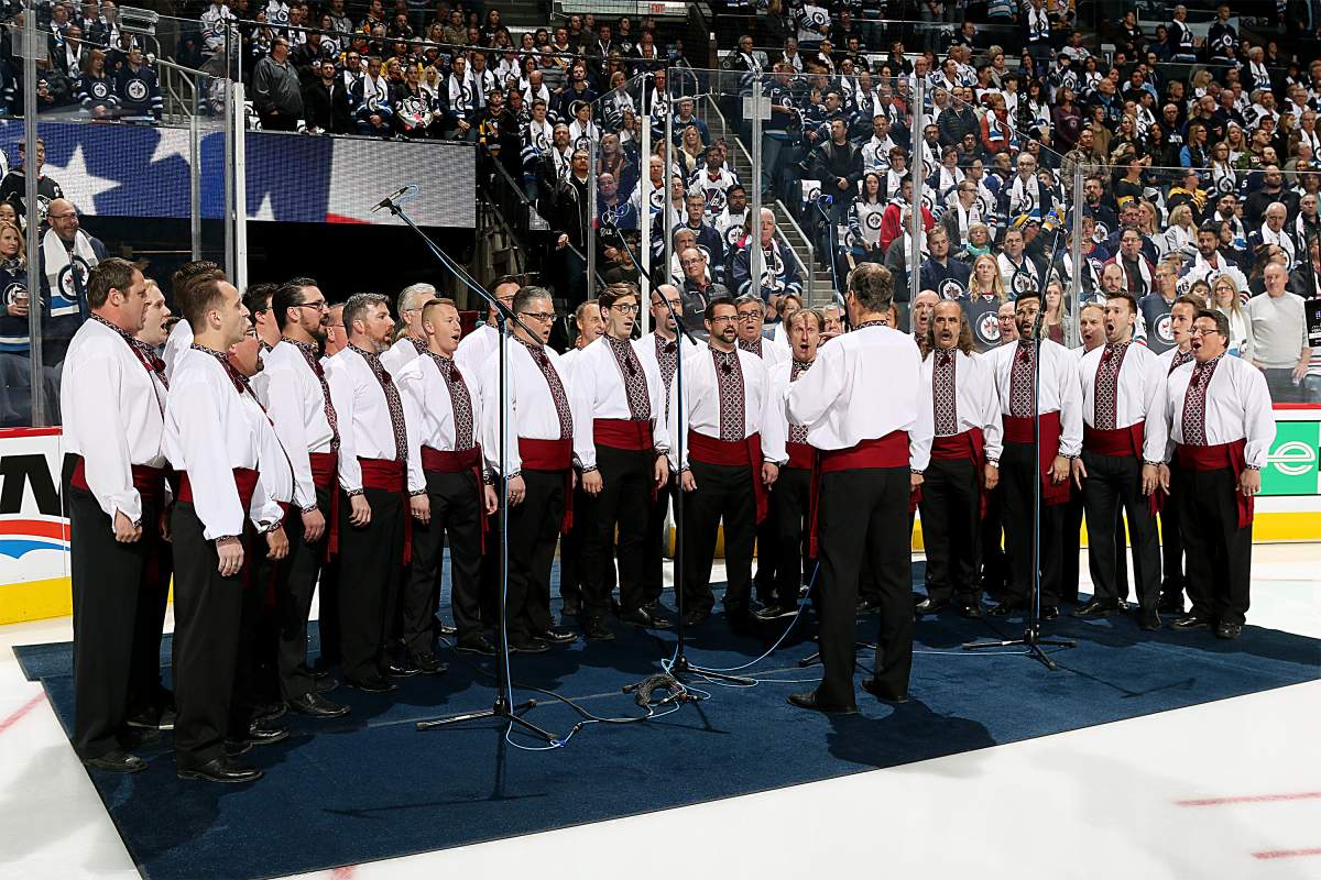  The Hoosli Ukrainian Male Chorus performs the National anthems prior to NHL action between the Winnipeg Jets and the Pittsburgh Penguins at the Bell MTS Place on October 29, 2017 in Winnipeg, Manitoba, Canada. 