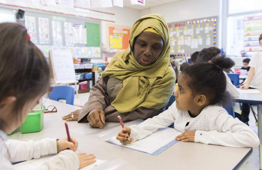 Kindergarten teacher Haniyfa Scott gives a lesson during class in Montreal, Thursday, April 4, 2019.