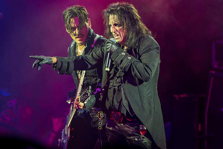 Johnny Depp (L) and Alice Cooper of Hollywood Vampires perform on stage at Celebrity Theatre on Dec. 8, 2018, in Phoenix, Ariz.