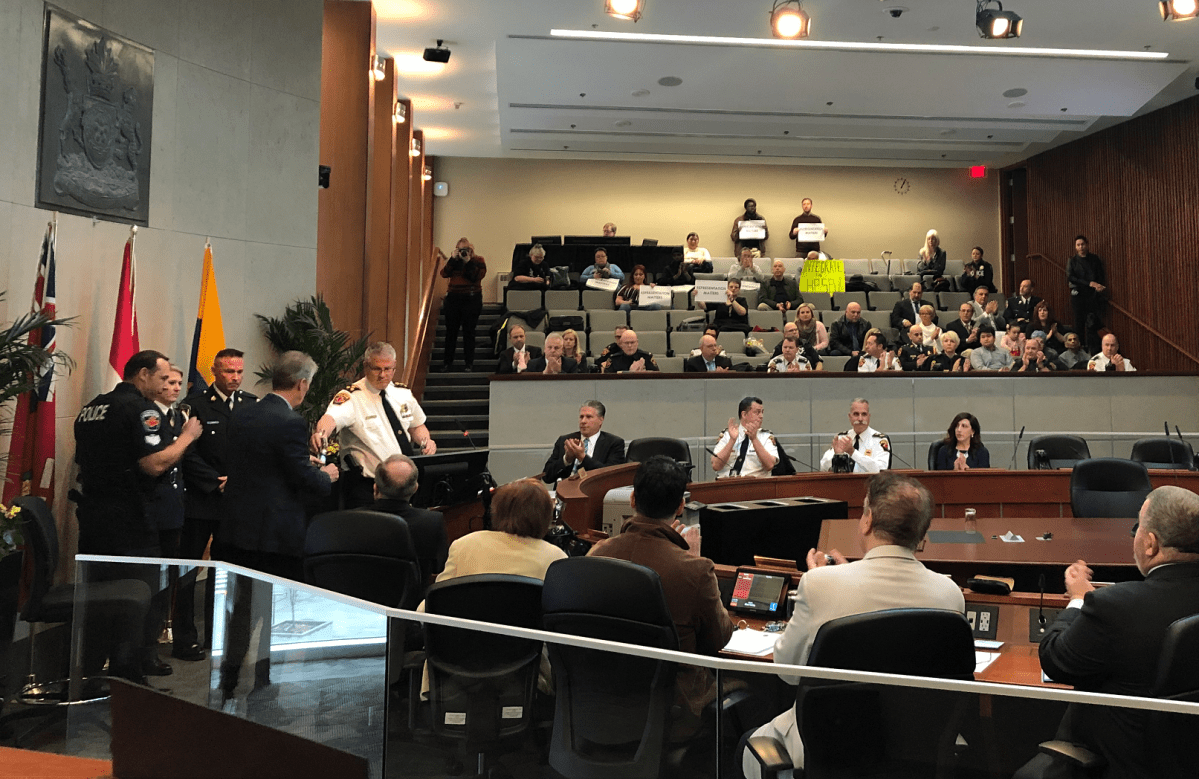 Diversity advocates sat on either side of council chambers during a Hamilton Police Services Board meeting on Thursday.