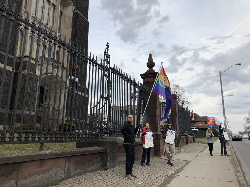 Labour and anti-poverty activists rallying outside of the King Street entrance to the Scottish Rite.