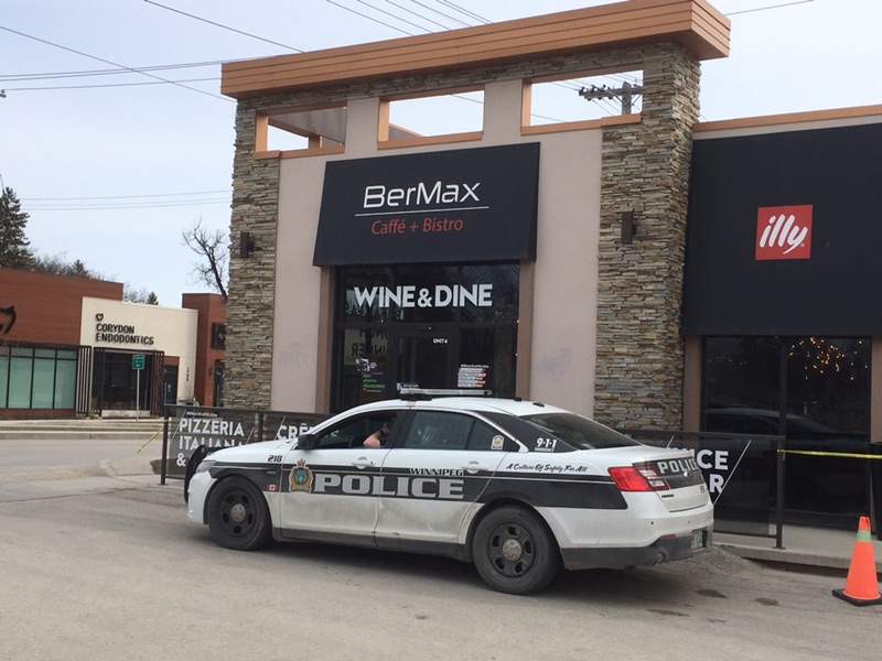 Winnipeg Police sit outside BerMax Caffe.