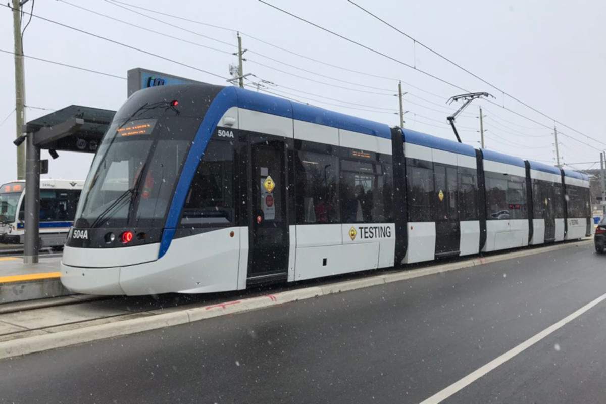 An ION train stops at Borden Station.