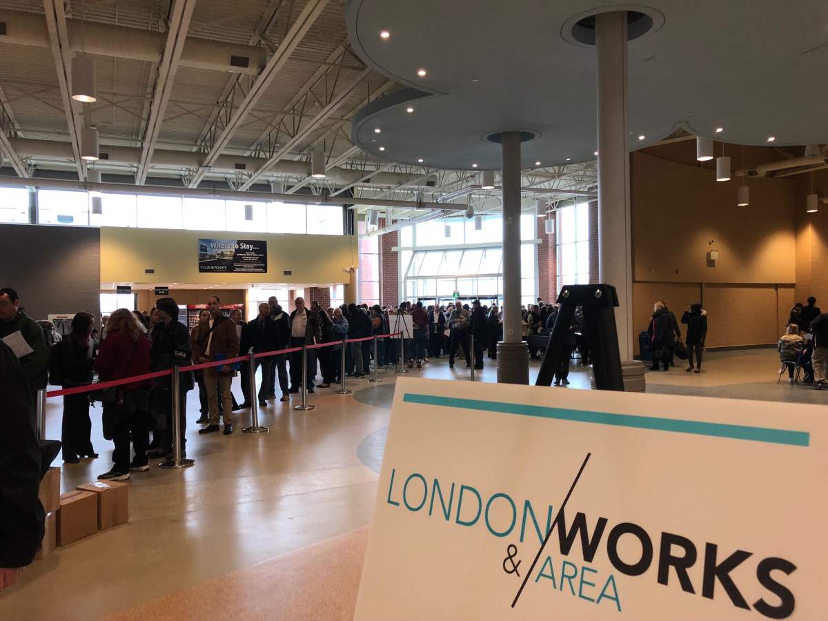 A line of job seekers stretching nearly out the door awaits the opening of the London and Area Works job fair.