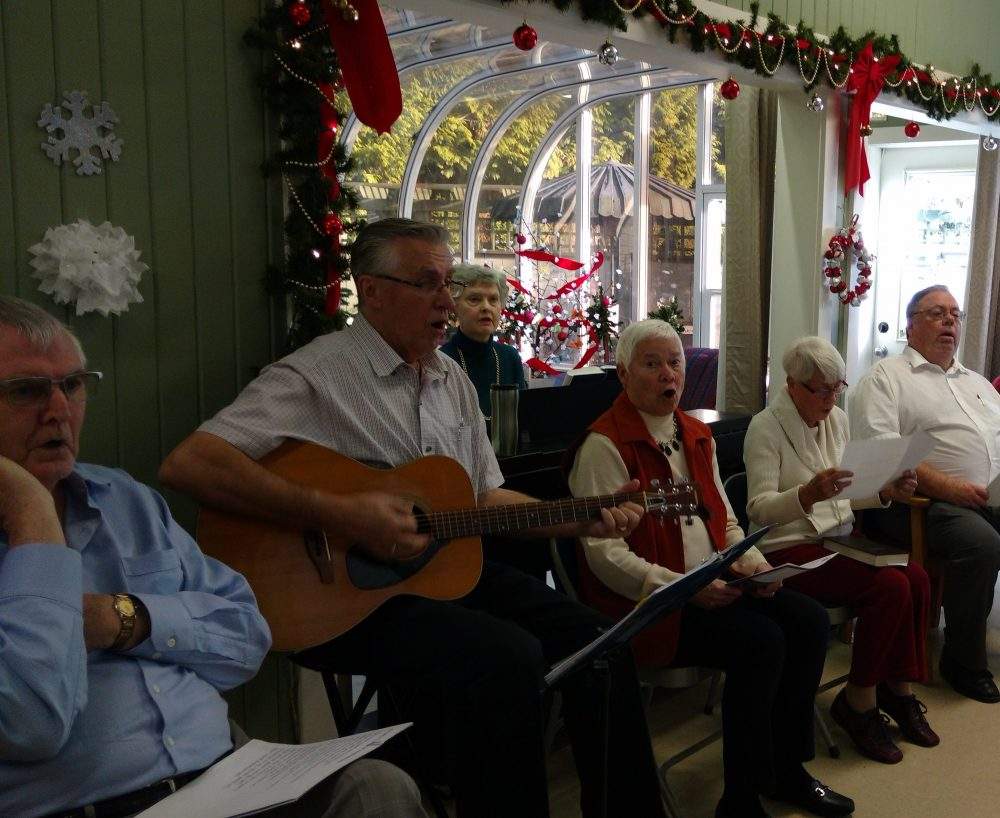 Martin Jurrius, far left, and his wife Barbel, third from right, sing at an event at West Vancouver Presbyterian Church.