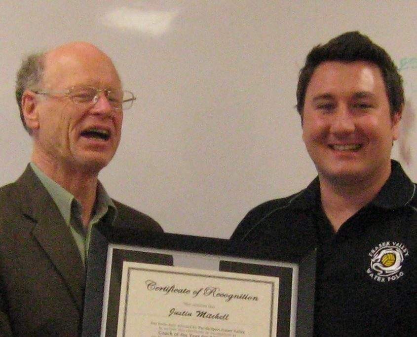Justin Mitchell, right, receives an award from PacificSport Fraser Valley for 2010 Coach of the Year.
