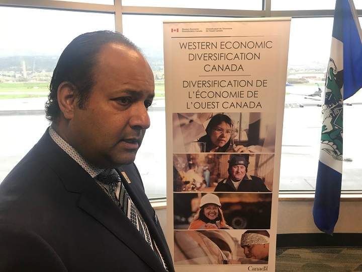 Kelowna airport manager Sam Samaddar discusses with the media what the federal funding means to the airport.