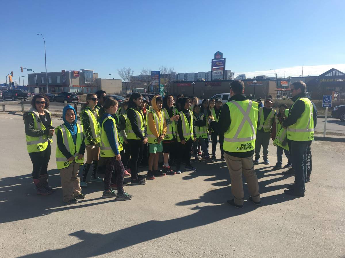 CAA School Safety Patrollers from Clifton School prepare to head out to pick up trash.